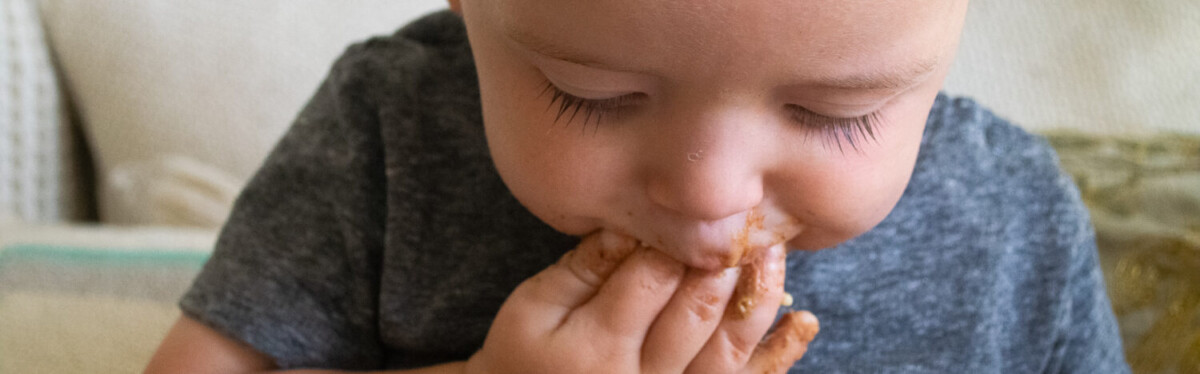 Our son digging into something tasty.