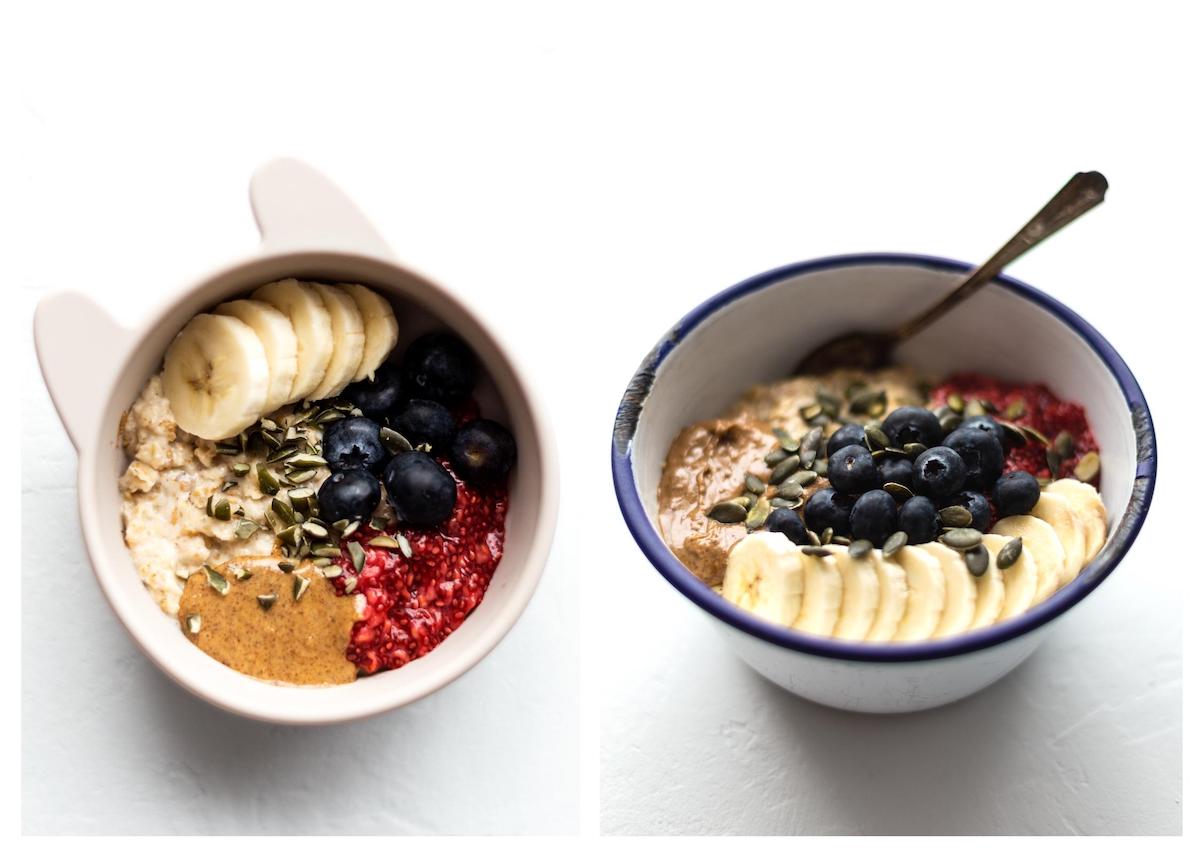 Porridge topped with raspberry chia jam, sliced banana, almond butter, fresh blueberries and pumpkin seeds.