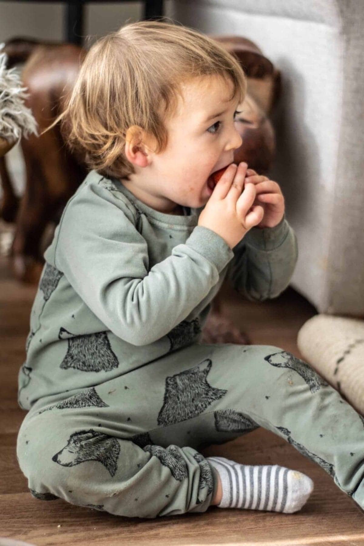 Our son eating a strawberry.